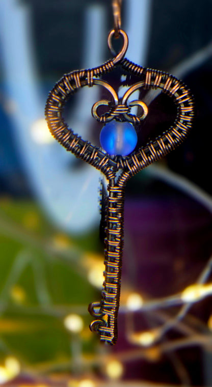 Key To My Heart – Copper Woven Key Pendant with Luminous Blue Bead