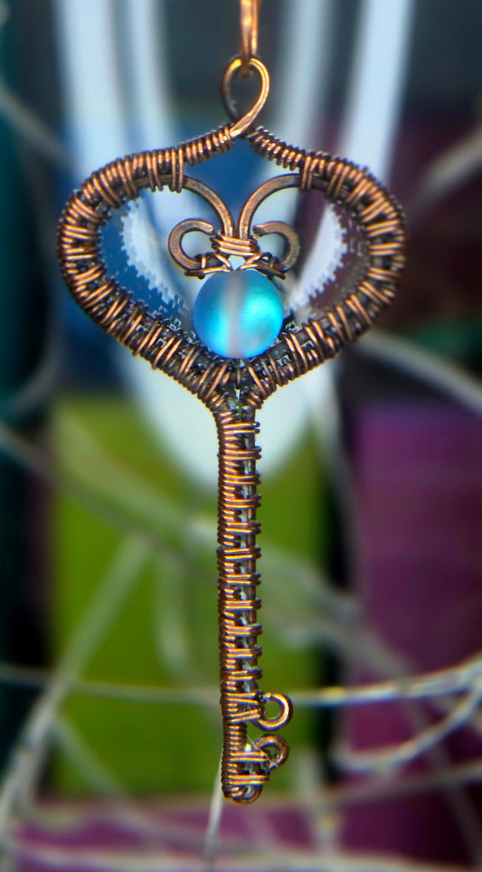 Key To My Heart – Copper Woven Key Pendant with Luminous Blue Bead